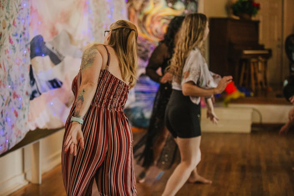 Dancers moving freely on the floor